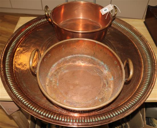 A Victorian copper two handled preserving pan and a large copper tray